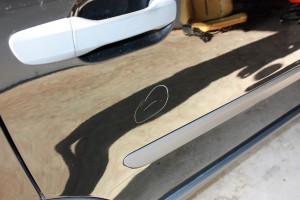 This deeper scratch appears to be caused by a key and will require some wet sanding or color sanding before being polished away